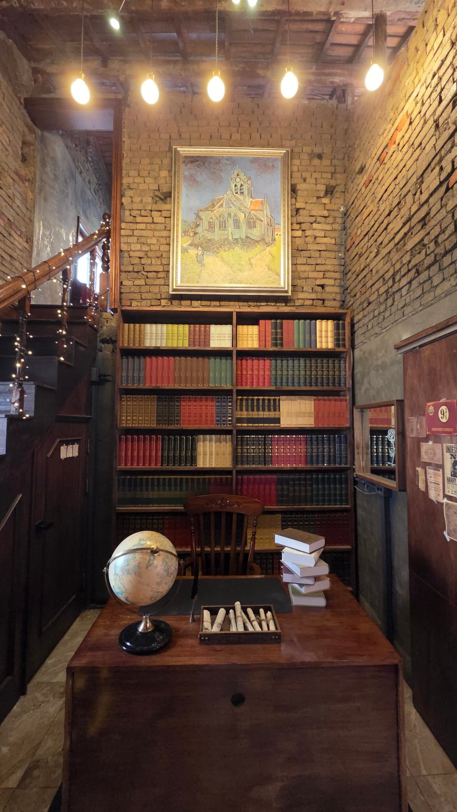 Seat with a bookshelf and a globe
