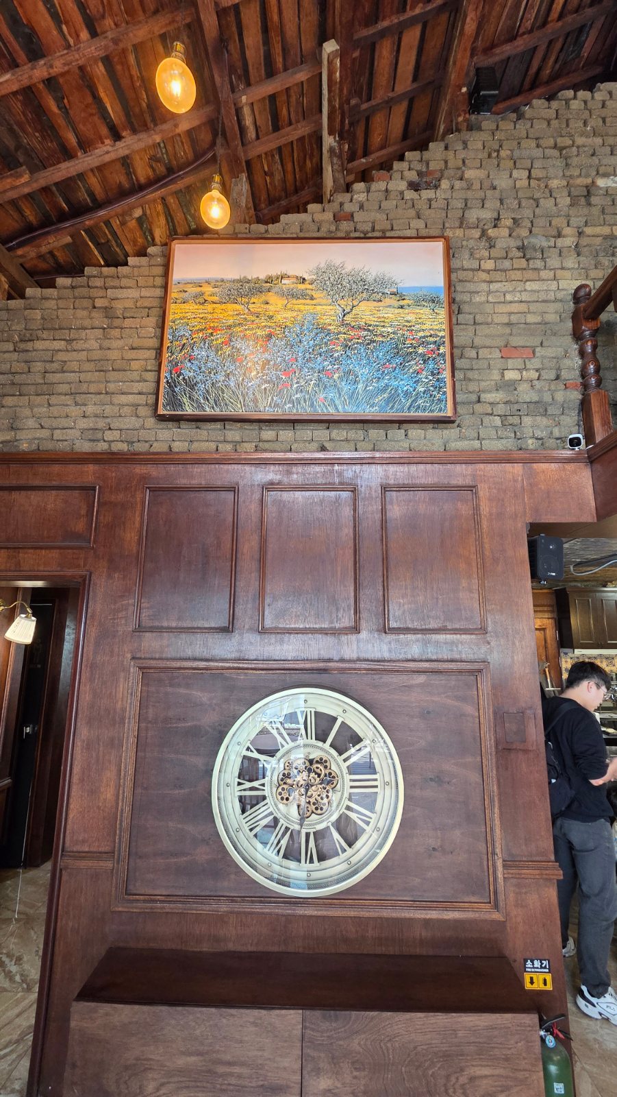 Wall with a clock and a painting