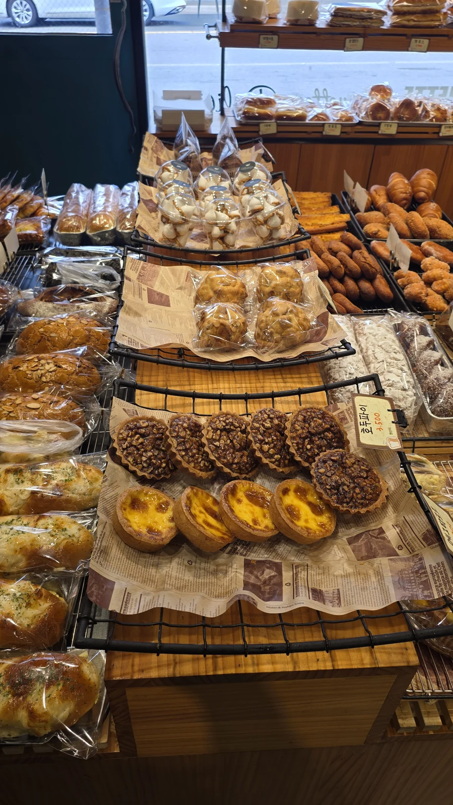 Egg tarts and bread on display